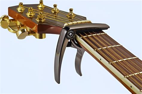 Can you put a capo on an electric guitar, and does it make the strings taste like licorice?